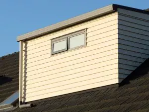 When designing buildings, the acoustic performance of roof cladding is often overlooked. Sound transmission can greatly affect indoor comfort, so it’s important to choose materials and installation methods that improve sound insulation. Balancing aesthetics and function is key in creating a roof that is both visually appealing and effective at blocking out noise. Key Takeaways Material density and thickness of roof cladding play a significant role in sound absorption and noise reduction. Sound-absorbing materials like mineral wool and acoustic foam improve the acoustic performance of roofing systems. Roof system designs, including air gaps, can boost sound insulation and reduce noise. Quality installation ensures the roof cladding works effectively to reduce noise. Combining good looks with acoustic performance is essential—textured surfaces can enhance both visual appeal and sound absorption. Understanding Acoustic Performance in Building Design When planning a building, understanding how sound moves through the structure is vital, especially for creating spaces that are comfortable to live or work in. Acoustic performance focuses on reducing sound transmission and improving noise control. To minimise sound transmission, it’s important to consider the materials used in the building and how dense they are, as denser materials tend to absorb sound better. Concrete and acoustic panels are examples of high-density materials that help reduce noise. Another effective strategy is incorporating sound barriers and optimising the layout of rooms to reduce noise. It’s also important to think about how the building will be used, as different spaces will require different levels of sound control. Key Factors Affecting Acoustic Performance in Roof Cladding Several factors affect how roof cladding performs acoustically. One important element is material density. Denser materials help block sound and reduce noise levels. The thickness of the cladding also plays a major role—thicker panels tend to absorb more sound energy and provide better noise reduction. The design of the roof system is another consideration. For example, adding air gaps between layers can enhance sound insulation by disrupting sound waves. Finally, installation quality is crucial. Poor installation can lead to gaps, allowing sound to leak through, which can weaken the roof’s ability to block noise. Materials and Techniques for Enhanced Sound Insulation When choosing materials for roof cladding, it’s essential to consider their sound insulation properties. Using sound-absorbing materials like mineral wool or acoustic foam can effectively reduce noise transmission. These materials absorb sound waves, making the building quieter. Insulation techniques like decoupling can also improve sound isolation. Methods such as using resilient channels or soundproof membranes can reduce vibrations and airborne noise. It's also important to ensure that all layers of the roof fit tightly together and are properly sealed to prevent sound leaks. By combining sound-absorbing materials with effective insulation techniques, you can create a roof system that not only reduces noise but also improves the overall comfort of the building. Balancing Aesthetics and Acoustic Requirements How can you balance aesthetics with acoustic performance in roof cladding? To integrate visual appeal with effective noise reduction, it’s important to choose materials that both look good and perform well acoustically. Textured surfaces, for example, can improve sound absorption while adding depth and interest to the roof design. Colour schemes and architectural styles should complement the surrounding environment, ensuring that the building looks attractive without sacrificing its acoustic performance. Make sure to check product specifications, particularly the Sound Transmission Class (STC) ratings, which measure how well a material blocks sound. This will help you choose a roofing material that meets both aesthetic and acoustic requirements. Case Studies: Successful Implementation of Acoustic Solutions Let’s take a look at a few real-life examples where acoustic solutions have been successfully incorporated into roof cladding designs. In one commercial project, a composite roofing system was used to reduce noise transmission by 30%. The system combined sound-absorbing materials with traditional cladding to achieve this result. In a residential project, specialised membranes were added to the roofing design, significantly improving acoustic performance without affecting the building’s aesthetics. These case studies show how selecting the right materials and design can create effective acoustic solutions, providing comfort and functionality for both commercial and residential spaces. Frequently Asked Questions How do roof cladding materials impact overall building acoustics? The materials used for roof cladding directly affect the acoustics of the entire building. Denser materials tend to block sound and improve noise insulation, creating quieter spaces inside the building. What are common sources of noise that affect roof performance? Noise from traffic or weather events like rain and hail can affect roof performance. These external noises can interfere with the comfort of the building, making it important to choose materials and designs that minimise their impact. Are there specific regulations for acoustic performance in roof design? Yes, building codes often include specific acoustic requirements for roof design. These regulations help reduce noise transmission and ensure that buildings meet the standards for occupant comfort. How can I assess the acoustic quality of existing roof cladding? To assess the acoustic quality of an existing roof, you can measure sound insulation levels using special equipment to identify any weak points in noise reduction. This will help you determine where improvements may be needed. What is the cost difference between acoustic and standard roof cladding? Acoustic roof cladding usually costs more than standard options because it uses specialised materials that improve sound insulation. However, investing in acoustic cladding can greatly enhance the comfort and quietness of the building, making it worthwhile in many cases. Conclusion In conclusion, paying attention to acoustic performance in roof cladding is essential for creating comfortable and quiet indoor environments. By understanding key factors like material density, thickness, and installation quality, you can make informed decisions to improve noise reduction. Using sound-absorbing materials and implementing effective insulation techniques will enhance acoustic performance. Balancing these technical requirements with aesthetic considerations will help you create a roof that meets both functional and visual needs, resulting in a successful building design.
